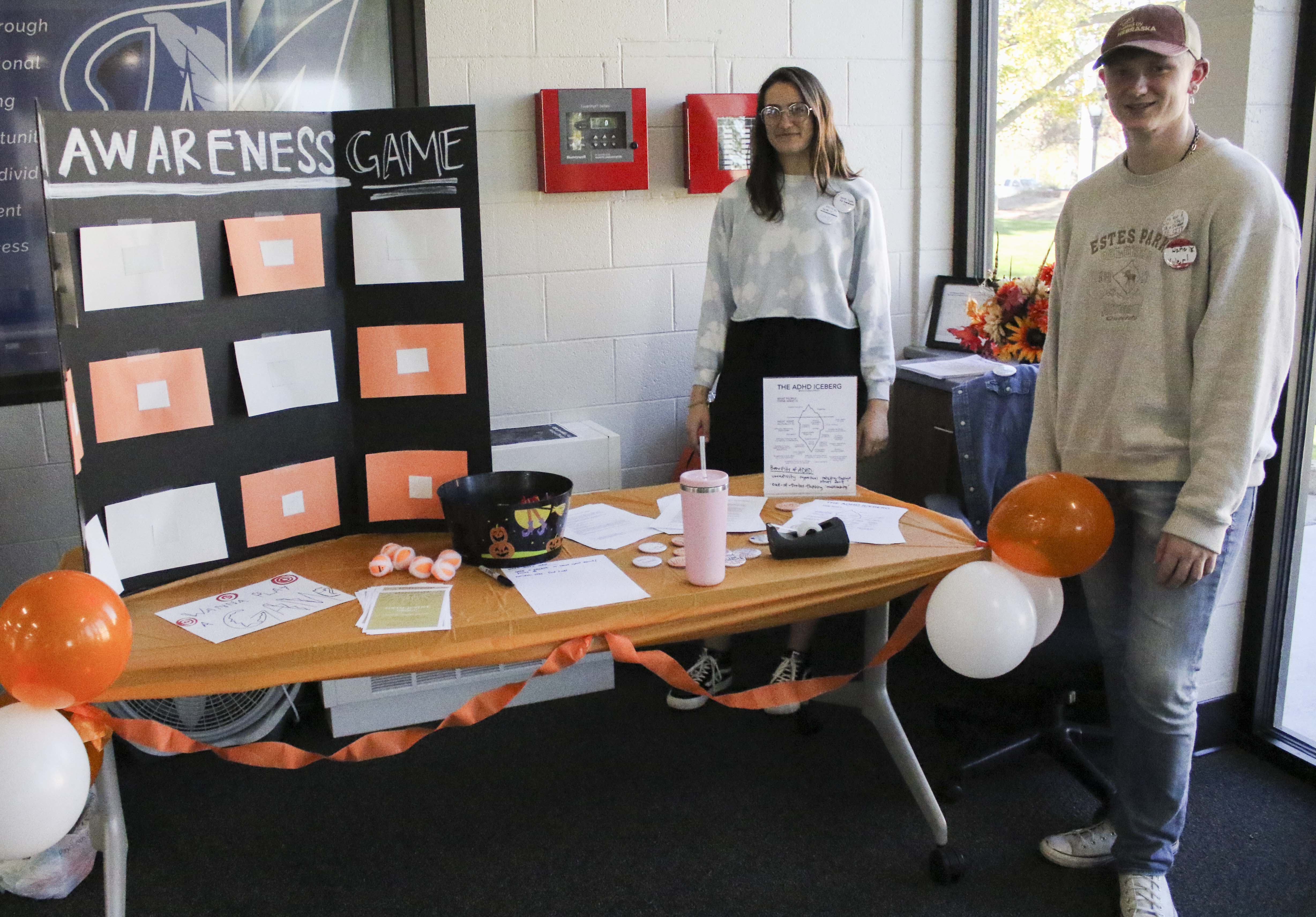 Sophomore Annika Johnson, McCook, and freshman Kyler Gaston, Trenton, helped set up an ADHD information station in the Learning Commons for the McCook Community College Social Justice Group.